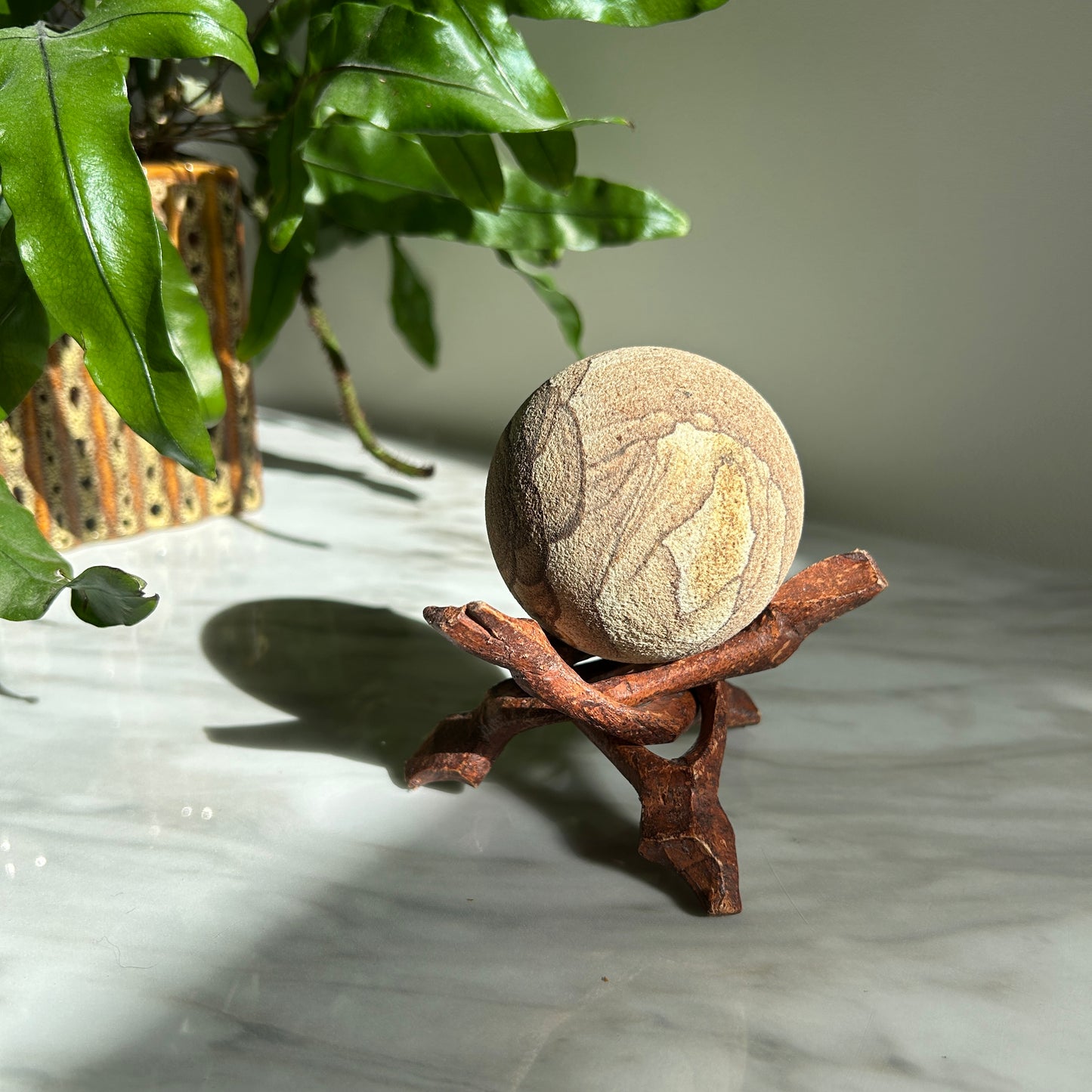 Vintage Sandstone Orb on Carved Wooden Base