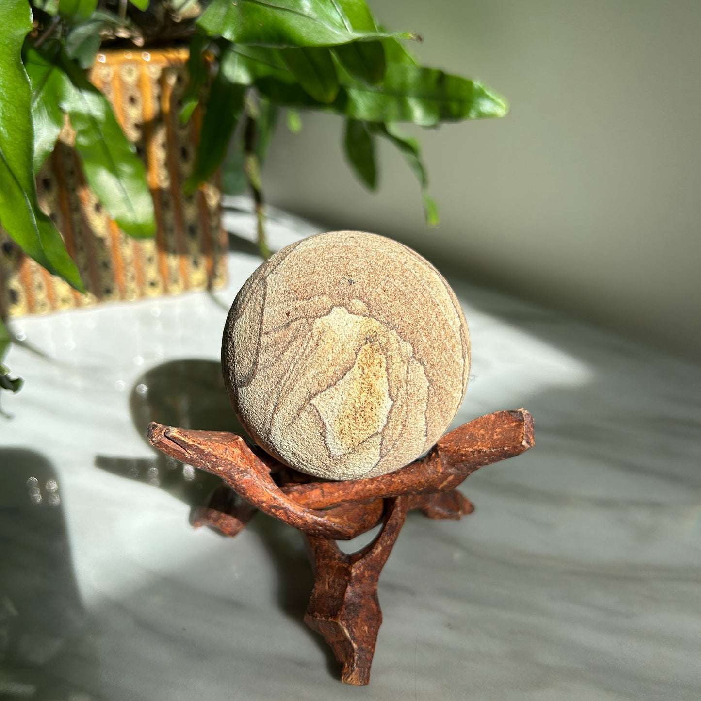 Vintage Sandstone Orb on Carved Wooden Base